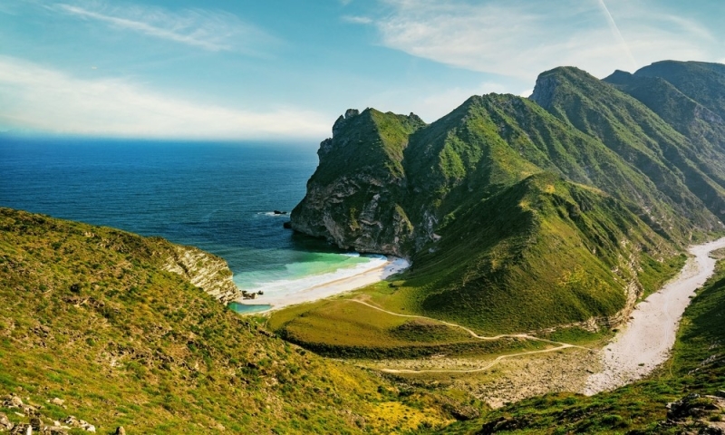 Mysterious Oman: dunes, forts, canyons and palm trees on the shore of the bay