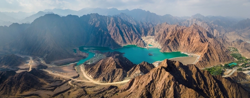 Mysterious Oman: dunes, forts, canyons and palm trees on the shore of the bay