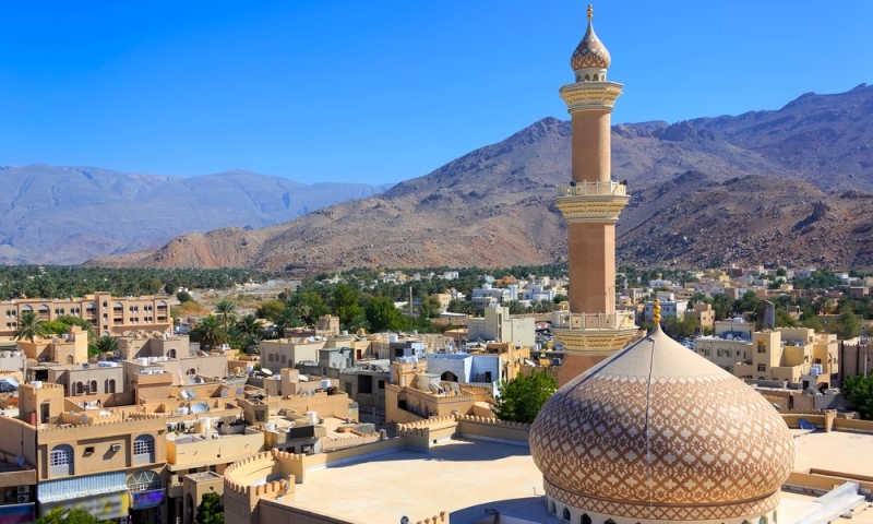 Mysterious Oman: dunes, forts, canyons and palm trees on the shore of the bay